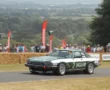 Tom Walkinshaw Racing car on a road with people in the background of the race circuit