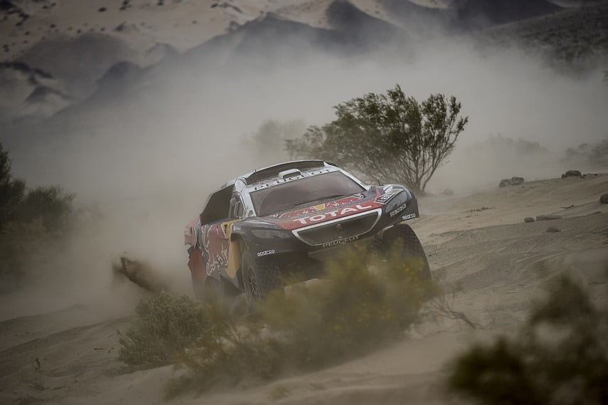 Loeb fighting the desert in his Peugeot