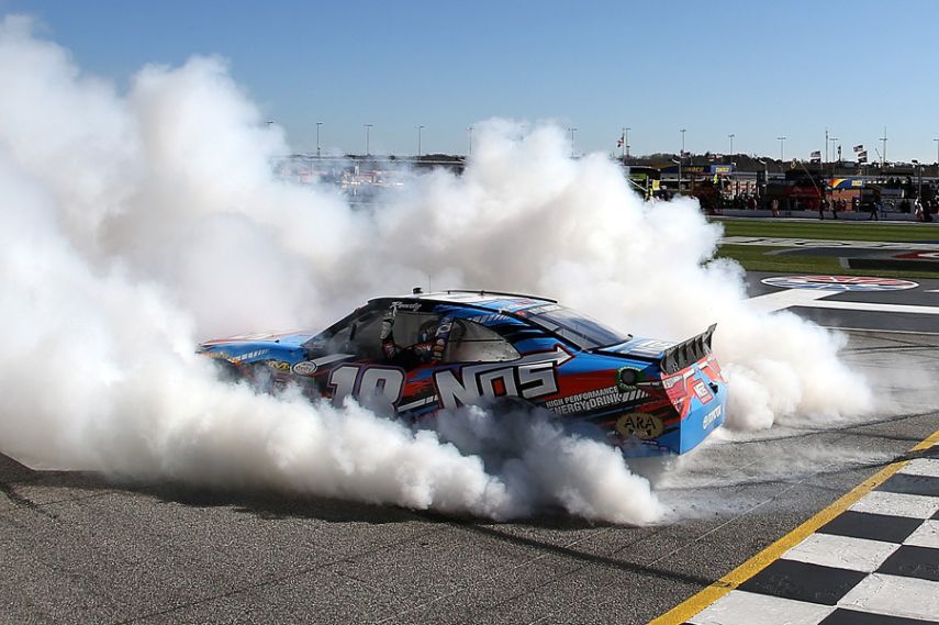 Kyle Busch celebrating victory in NASCAR Xfinity Series race at Atlanta Motor Speedway