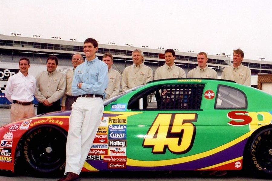 Adam Petty next to his 1999 Busch Series race car, the #45 Chevrolet