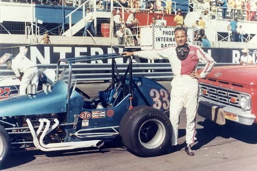 Driver posing with his vehicle