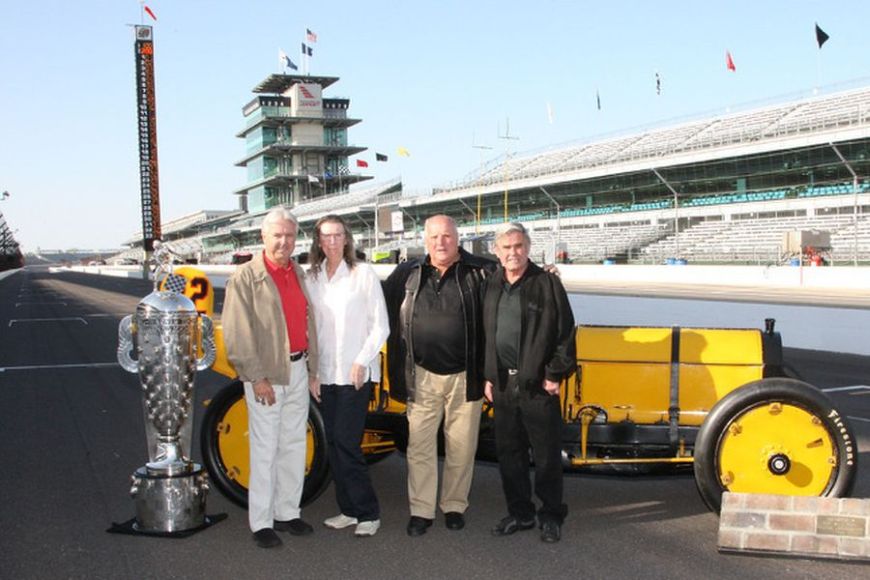 Rick Mears, Mari Hulman George, A.J. Foyt and Al Unser Sr. Rick Mears, Mari Hulman George, A.J. Foyt and Al Unser Sr with the trophy