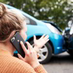 Woman Calling A Car Accident Lawyer