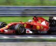 A Red Ferrari F1 Car Racing