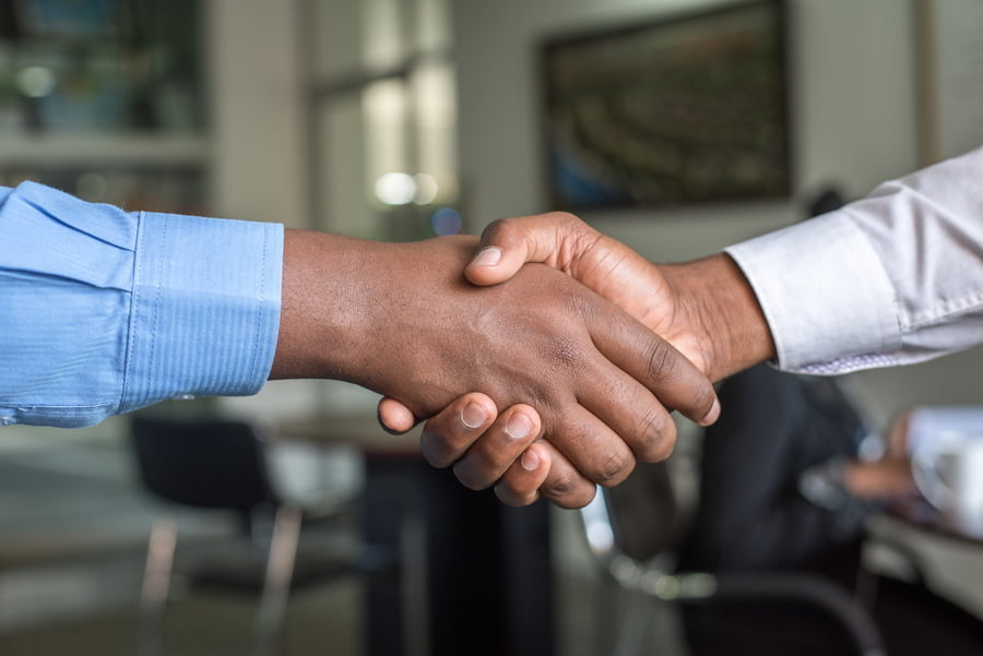 Hands Shaking After Making A Deal