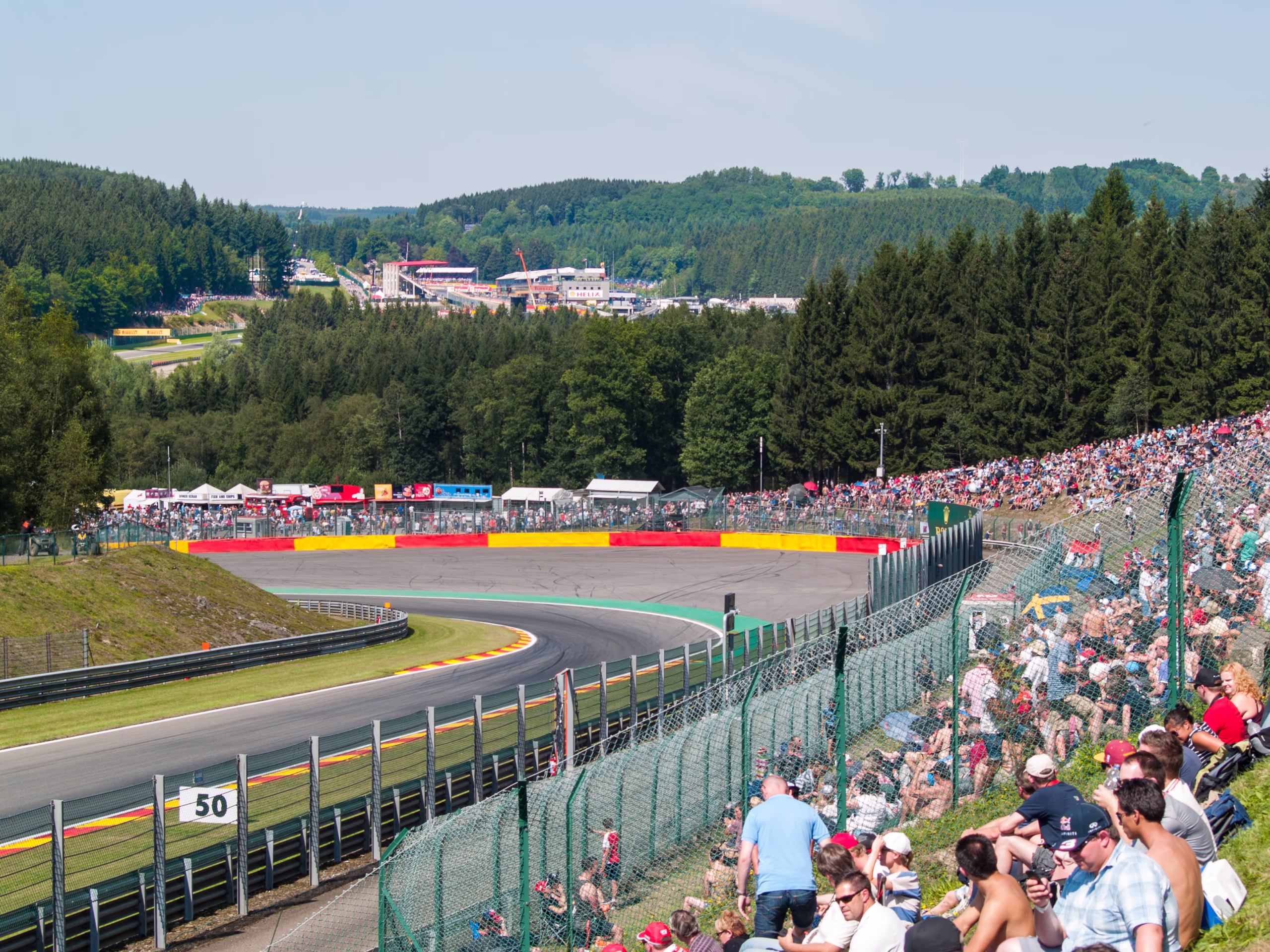 Formula 1 cars at Pouhon corner during the 2015 Belgian Grand Prix at Spa-Francorchamps